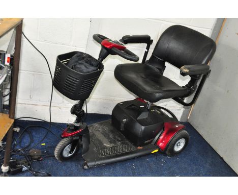 A PRIDE GOGO ELITE TRAVELLER DISABILITY SCOOTER with one key, charger and cover (some damage to arm rests) (PAT pass and work