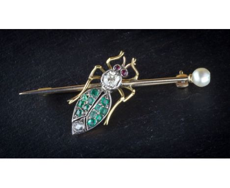 An antique yellow gold, diamond, emerald and ruby insect bar brooch, the winged insect set with two cushion and rose cut diam