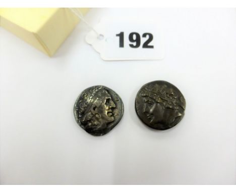 Two ancient Greek coins, Ptolemy II c285 - 246 BC silver & Phiip II c359 - c356 BC bronze.