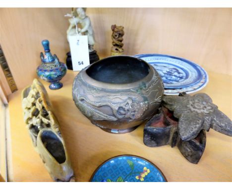 A small group of Chinese soapstone carvings, brass and ceramicsto include a seal/scroll weight with entwined serpents, a figu