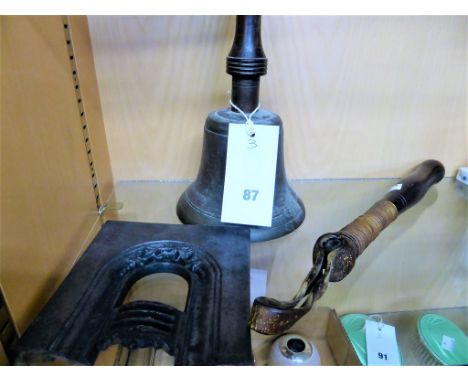 A Victorian nightstick/truncheontogether with an antique bronze hand school bell & a miniature travelling salesman cast iron 