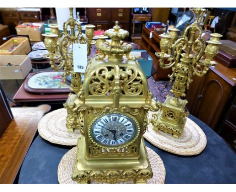 A gilt brass Ormolu mantel clock garniture20th century, Rococo scroll decorated gilt case, 4«in. white enamel dial with Roman