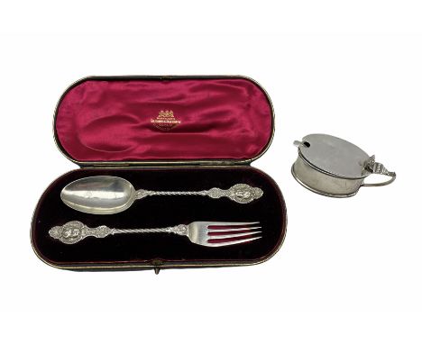 Late Victorian silver christening spoon and fork with cherubic mask finials London1895/6 in Goldsmiths and Silversmiths case 