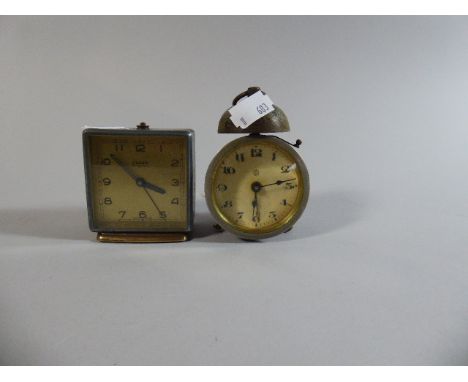 A Small Swiza Mignon Alarm Clock and a Small Drum Alarm Clock