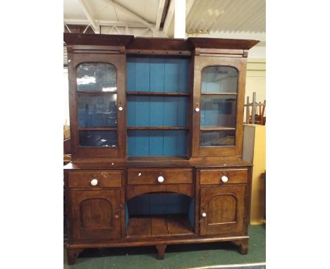 A 19th Century Oak Dresser with Centre Drawer Over Recessed Storage Area Flanked by Single Drawers Over Cupboards, Raised Pla