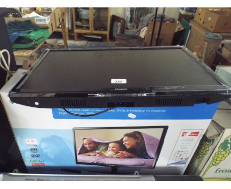 A Polaroid 22" LED TV with DVD Complete with Stand and Remote Etc 