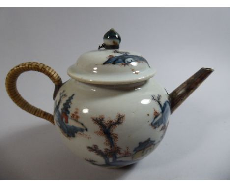 An Oriental Ceramic Teapot with Raffia Handle and White Metal Spout 