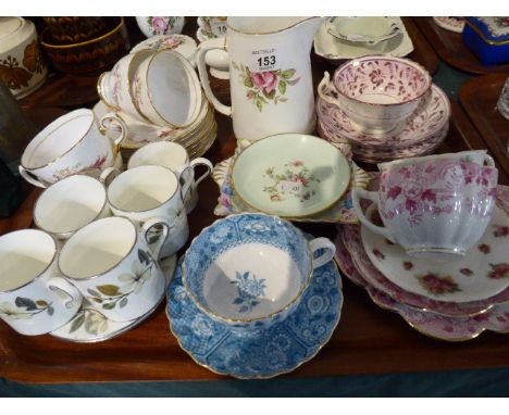 A Tray of Various Floral Patterned Coffee Cans and Saucers  