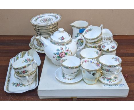 A Coalport Ming Rose pattern tea set with twelve cups, saucers, plates, a tea pot and other itemsLocation: 