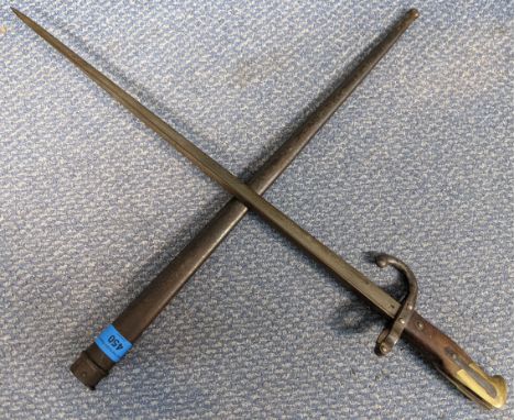 An 1874 pattern French bayonet for the Gras rifle, together with scabbard. Scabbard and hilt stamped with various proof marks