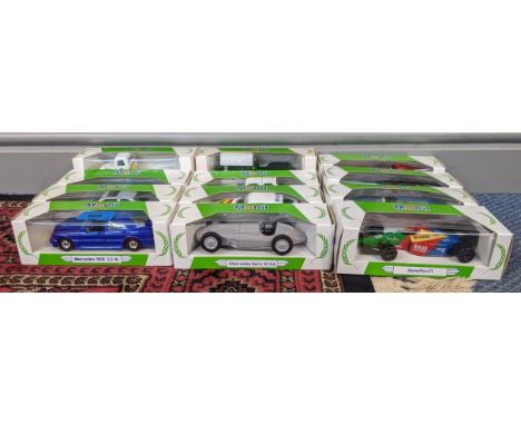 Twelve boxed Mobil - Corgi boxed vehicles to include a Volvo Racing Truck, Bentley 4.5 litre, Ferrari 308 GTS and othersLocat
