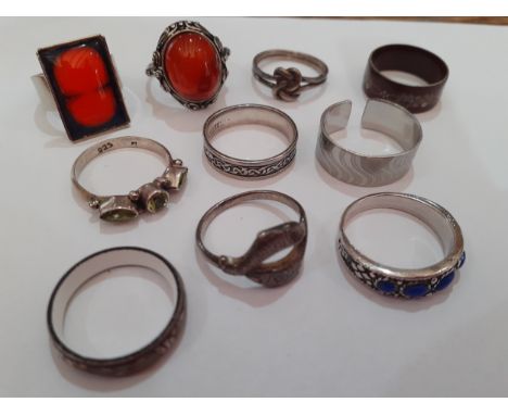 A quantity of dress rings to include silver and white metal examples and a Shetland white metal engraved band together with m