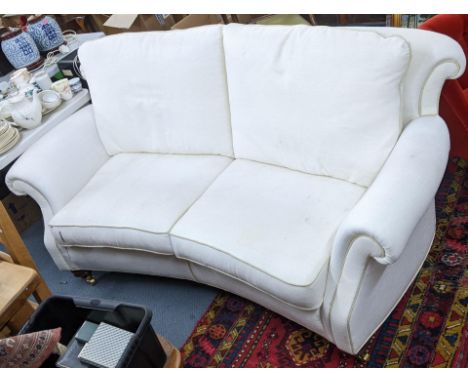 A Brights of Nettlebed white upholstered three seater sofa on front turned legs with castors, 90cm h x 200cm wLocation: 