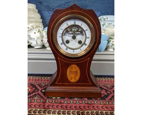 An Edwardian mahogany 8-day mantel clock, the enamel dial having a visible Brocot escapement striking on a single bell Locati