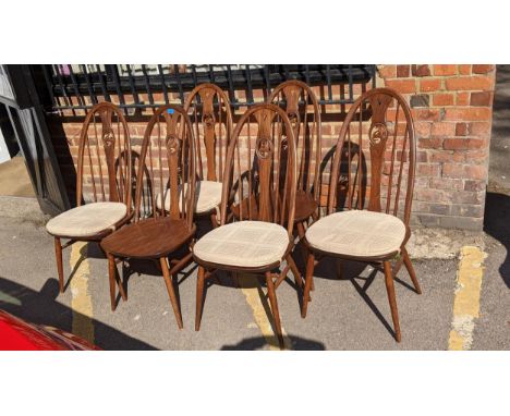 A set of six mid 20th century Ercol swan dining charsLocation: 