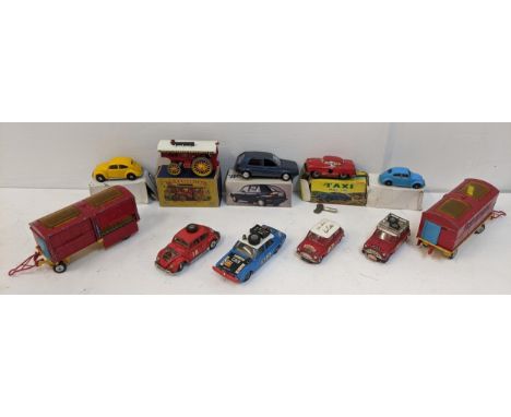 A selection of toys to include a Corgi Hillman Hunter mark II, Corgi Major Chipperfields, Corgi small size Taxi with box and 