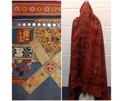 Worldwide vintage textiles, panels and insertions to include an embroidered wall covering having a rust coloured ground 89" x