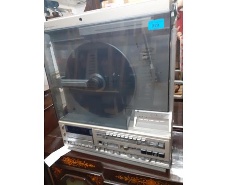 A Mitsubishi vertical X-12 turntable and stereo audio system with radio tuner and cassette deck Location: 