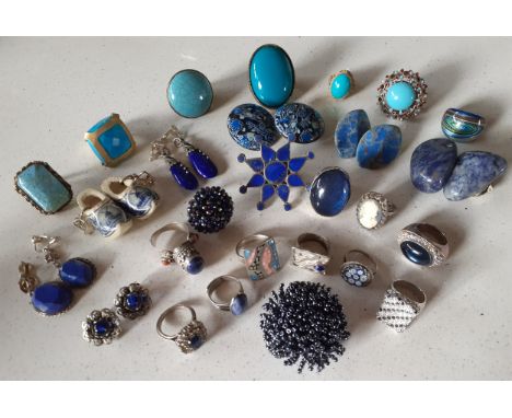 A quantity of silver, white metal and silver tone dress rings with blue cabochons to include a Birmingham silver mille fleuri