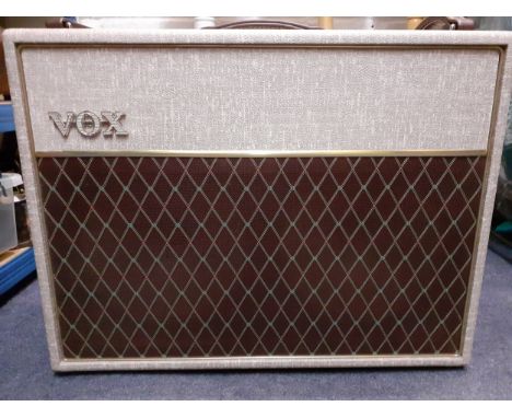 A vintage Vox Redland Shadow amp having 3 brown leather carry handles and 2 internal Goodmans Audiom 50 bass speakers, incorp