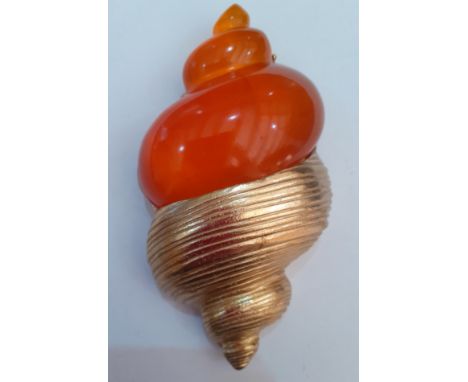 Christian Dior-A late 1980's gold tone and orange resin brooch in the form of a shell designed by Robert Goosens in 1987 for 