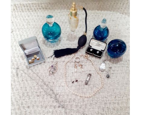 Three glass perfume bottles to include an indistinctly signed blue glass bottle with clear glass stopper together with a blue