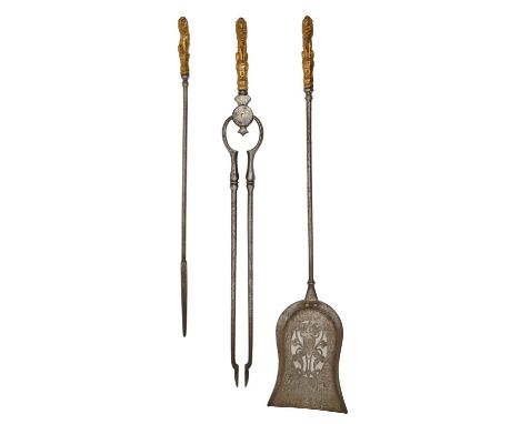A set of three Victorian burnished steel fire irons, with cast gilt lacquered lion sejant handles, tongs 73cm l Good quality 