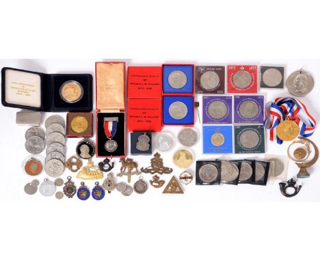 Miscellaneous British Army regimental cap badges, silver and enamel sporting prize fobs, a Maria Theresa Thaler, 1780 and mis
