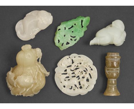 A Chinese jade carving of a squash, 70mm l, three other jade carvings and two white and other pierced jade carvings