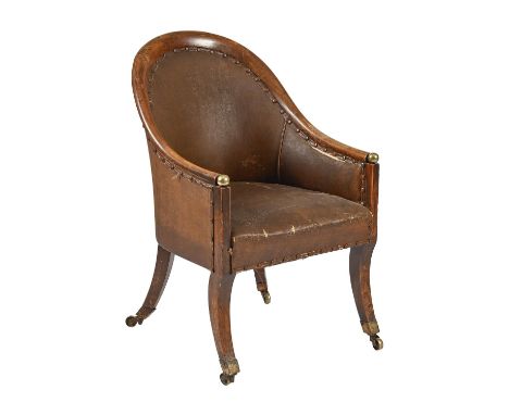A grained rosewood bergère, early 19th c, on sabre legs and brass castors, later leatherette upholstery, seat height 43cm h, 