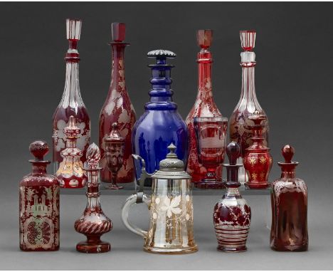 A group of Victorian glass, to include seven ruby flashed decanters and stoppers, a tankard, with pewter cover and a ruby gla