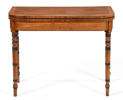 A George IV mahogany card table, crossbanded in satinwood and rosewood, on ring turned legs, 74cm h; 44 x 90cm and a&nbsp;Geo