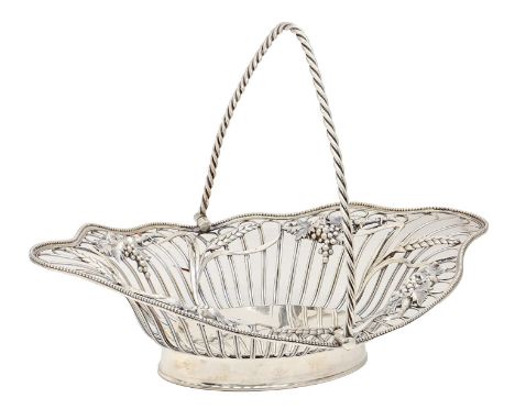 An Edwardian silver wirework basket, applied with die stamped grapevines and wheatears, twisted swing handle, on plain foot, 