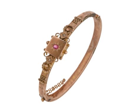An Edwardian chip diamond, synthetic ruby and 9ct gold bangle, 57mm (internal), part marked, 7g Old solder repair
