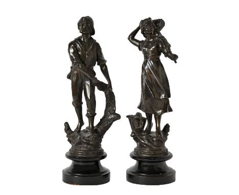 A pair of bronzed spelter figures of a fisherman and woman, first half 20th c, on turned ebonised bases, 37cm h Some wear to 