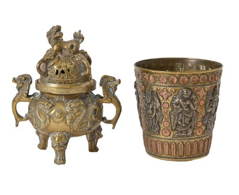 A Chinese brass tripod censer and cover, 19th / early 20th c, 14cm h and an Indian silver and copper-ornamented brass beaker,