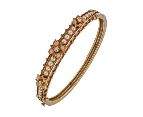 A Victorian diamond and pearl bangle, c1900, in gold, 56mm w (internal), unmarked, 21g A good quality example in excellent pr