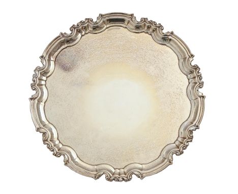 A George V silver salver, on three volute feet, 31cm diam, by William Hutton &amp; Sons Ltd, Sheffield 1914, 28oz 10dwt A few