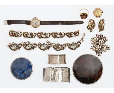 Two 9ct gold lady's wristwatches, a painted porcelain set 9ct gold ring, a suite of costume jewellery by Jewellcraft, 1950s, 