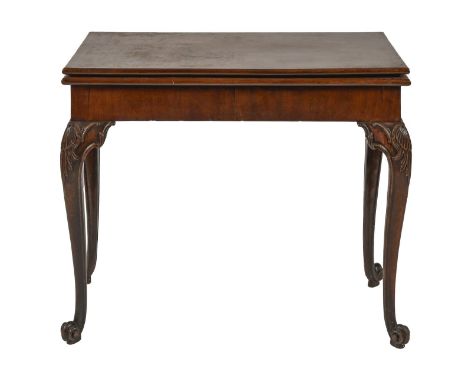 A George II mahogany card table, with concertina action, on carved legs with volute feet, 73cm h; 45 x 91cm Top leaf slightly