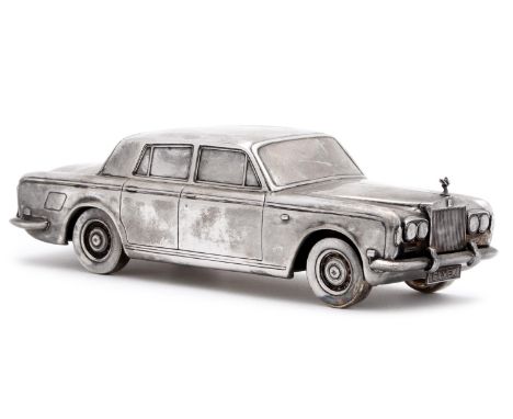 An Elizabeth II silver model of a Rolls Royce Silver Shadow motor car, 21cm l, the underside engraved&nbsp;Conavon Reproducti