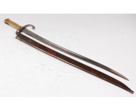 A French model 1866 chassepot bayonet, having a 57cm yataghan shaped fullered blade stamped to the back edge Mre d'Armes de C