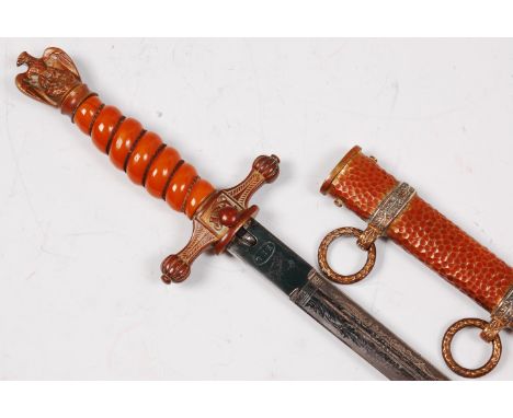 A German Third Reich Kriegsmarine Naval Officer's dagger, having a 25cm etched double fullered blade bearing P.D. Luneschloss