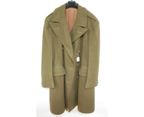 A WW II British Army Officer's great coat, having brown leather buttons and bearing a label Coat, British Warm Size 10. Josep