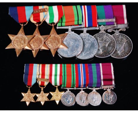 A group of seven medals to include WW II 1939-45 Star, Italy Star with 8th Army clasp, Africa Star, Defence, War, General Ser