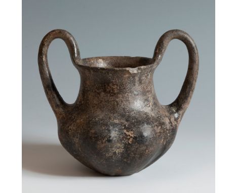 Two-handled impasto vessel from the Villanovan culture, 750-650 BC.Terracotta.Provenance: private collection, Cannes, France.