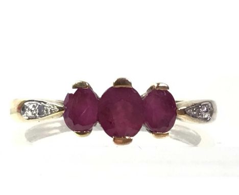 RUBY AND DIAMOND RING, NINE CARAT GOLD set with four diamondsQty: 1.9g