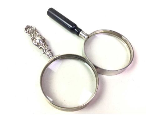 SILVER HANDLED MAGNIFYING GLASS, ALONG WITH TWO OTHERS  the handle embossed with scrolls13.5cm longQty: 3