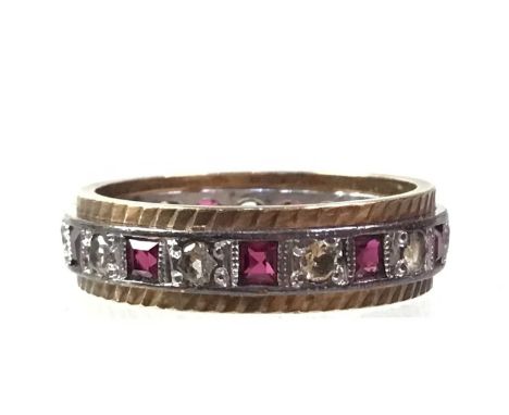 RUBY ETERNITY RING, interspaced with clear stones, in nine carat gold, size L 1/2Qty: 3.6g