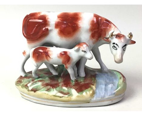 STAFFORDSHIRE STONEWARE GROUP, ALONG WITH A CARLTON WARE DISH the 19th century group in the form of a cow and calf, the dish 